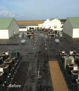 Weathered commercial flat roof with rooftop HVAC units before silicone roof coating restoration